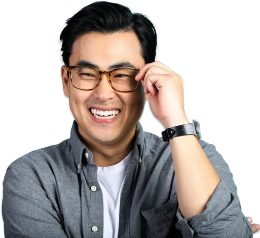 Smiling Lensabl customer adjusting his prescription glasses